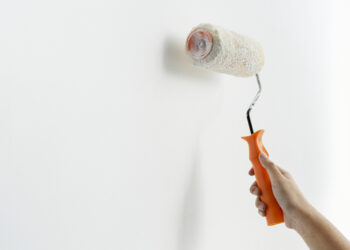 Hand painting the wall white